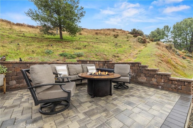 view of patio with a fire pit