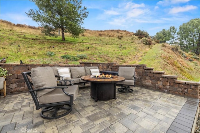 view of patio featuring an outdoor fire pit