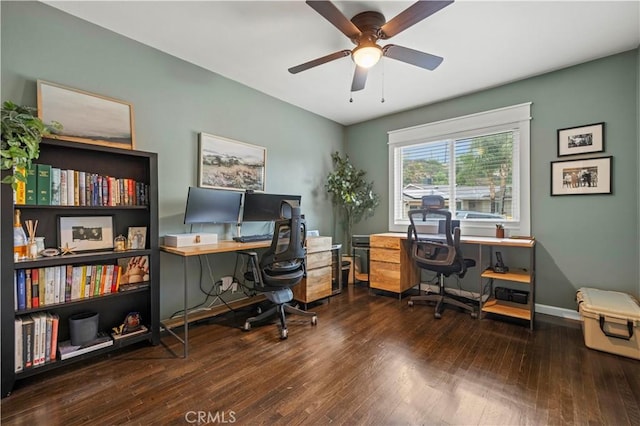 home office with hardwood / wood-style floors, a ceiling fan, and baseboards