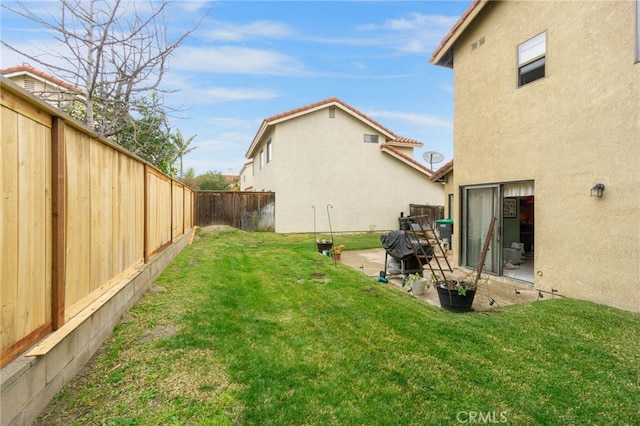 view of yard featuring a patio and a fenced backyard