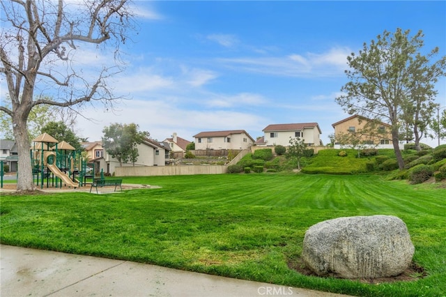 view of yard with playground community and a residential view