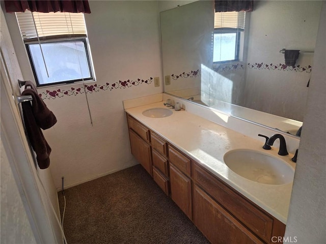 full bath featuring double vanity and a sink