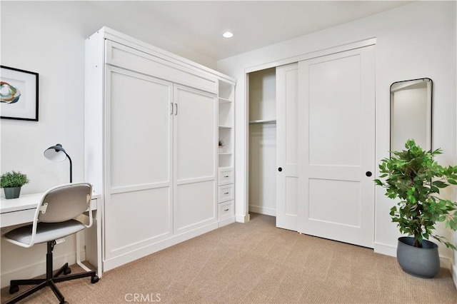 interior space featuring recessed lighting, a closet, and light carpet