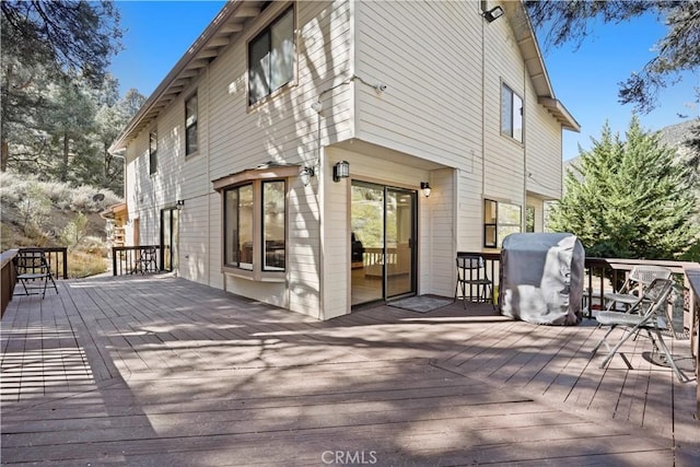 wooden deck featuring grilling area