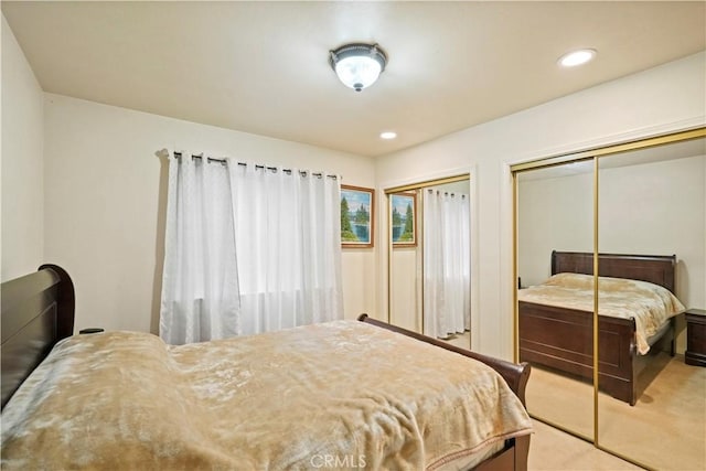 carpeted bedroom with recessed lighting