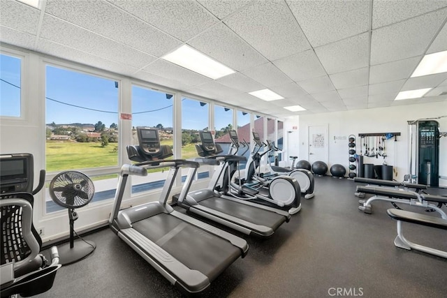 workout area with a paneled ceiling