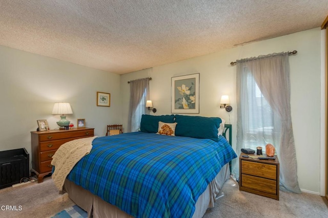 carpeted bedroom with a textured ceiling