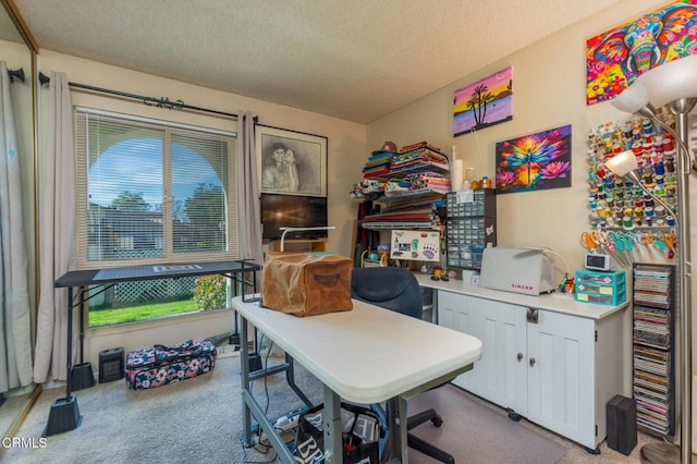 carpeted home office with a textured ceiling