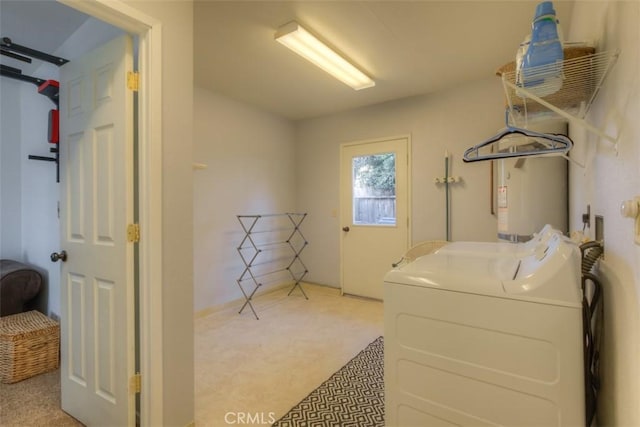 washroom featuring water heater, laundry area, and light carpet