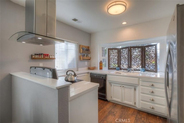 kitchen with dark wood-style flooring, visible vents, black dishwasher, ventilation hood, and freestanding refrigerator