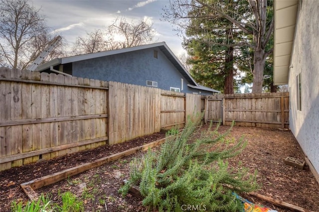 view of yard featuring a fenced backyard