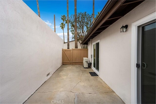 view of patio featuring fence