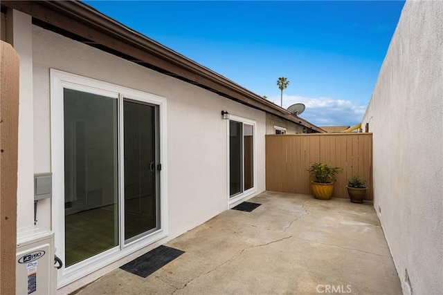 view of patio / terrace featuring fence