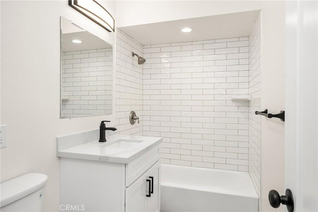 bathroom featuring shower / tub combination, vanity, and toilet