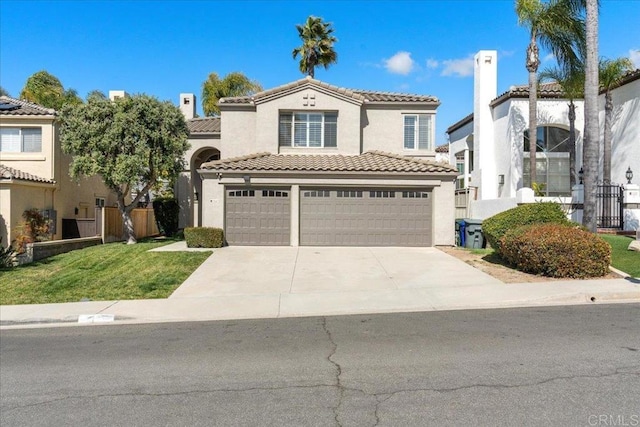 mediterranean / spanish-style home with stucco siding, an attached garage, fence, driveway, and a tiled roof