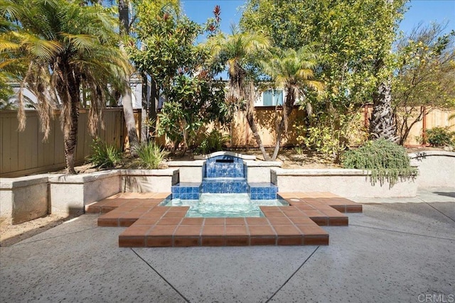 view of community featuring a patio area and a fenced backyard