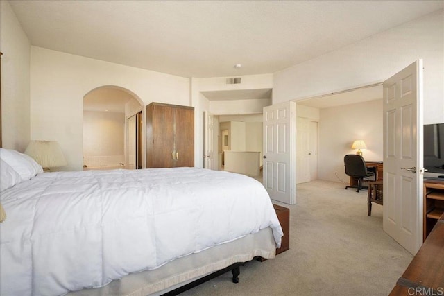 bedroom with light carpet and visible vents