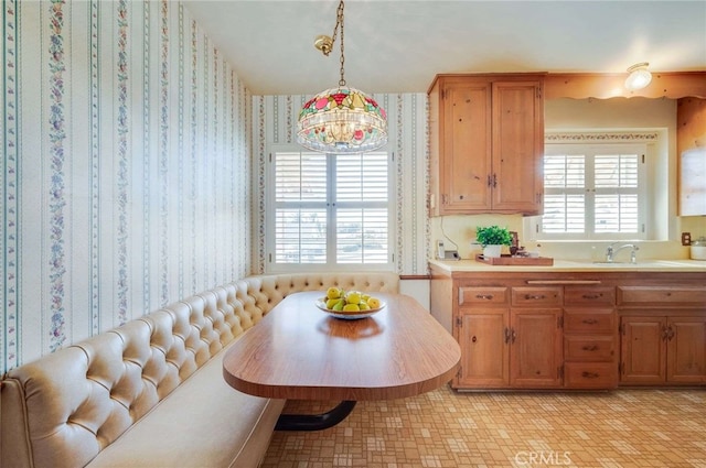 dining area featuring wallpapered walls and breakfast area