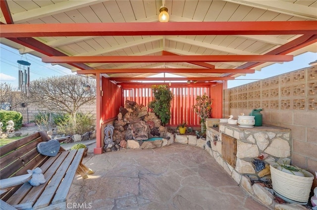 view of patio featuring fence