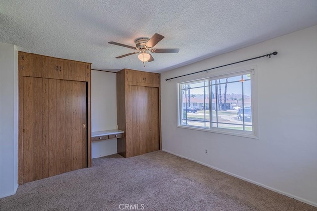 3667 Ada Ct, Riverside, CA 92505 - unfurnished bedroom featuring carpet floors, a textured ceiling, and ceiling fan