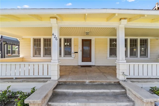 doorway to property with a porch