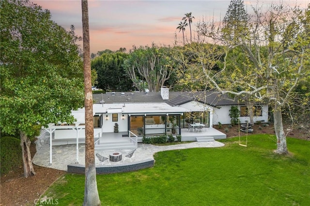 5353 Middlecrest Rd, Rancho Palos Verdes, CA 90275 - back of house with a yard, a wooden deck, and a chimney
