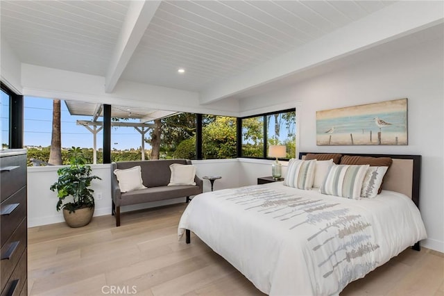 bedroom with recessed lighting, beam ceiling, light wood-style flooring, and baseboards