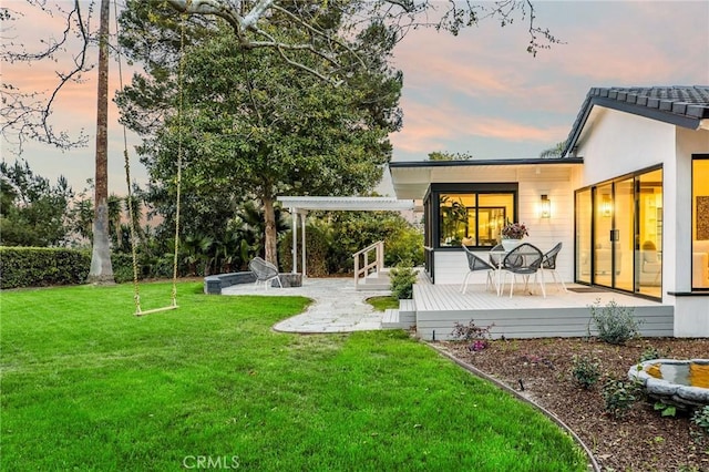 5353 Middlecrest Rd, Rancho Palos Verdes, CA 90275 - yard at dusk featuring a patio, a yard, and a wooden deck