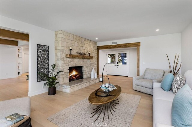 5353 Middlecrest Rd, Rancho Palos Verdes, CA 90275 - living room featuring light wood-type flooring, a stone fireplace, recessed lighting, and baseboards