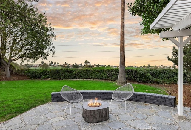 view of patio featuring an outdoor fire pit and a pergola