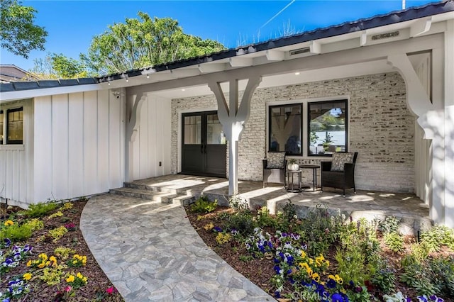 5353 Middlecrest Rd, Rancho Palos Verdes, CA 90275 - view of exterior entry with brick siding and board and batten siding