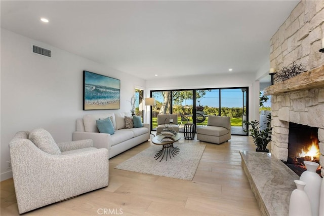 5353 Middlecrest Rd, Rancho Palos Verdes, CA 90275 - living room with a stone fireplace, light wood-style floors, and recessed lighting