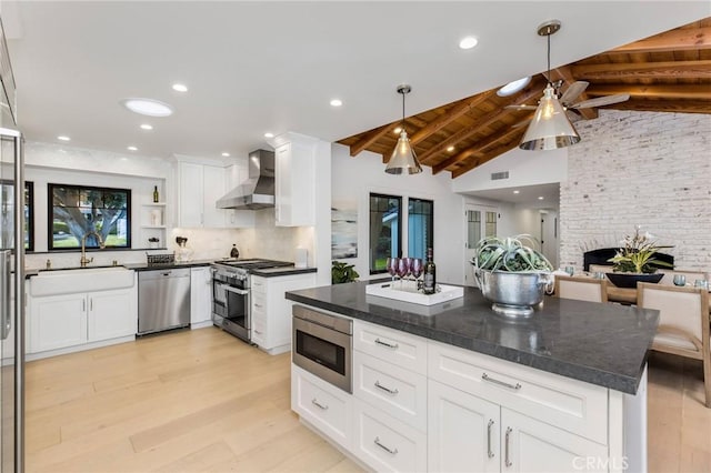 5353 Middlecrest Rd, Rancho Palos Verdes, CA 90275 - kitchen with wall chimney exhaust hood, stainless steel appliances, a sink, light wood-style flooring, and recessed lighting