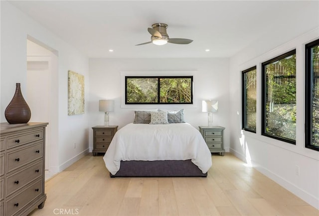 bedroom featuring a ceiling fan, recessed lighting, baseboards, and light wood finished floors