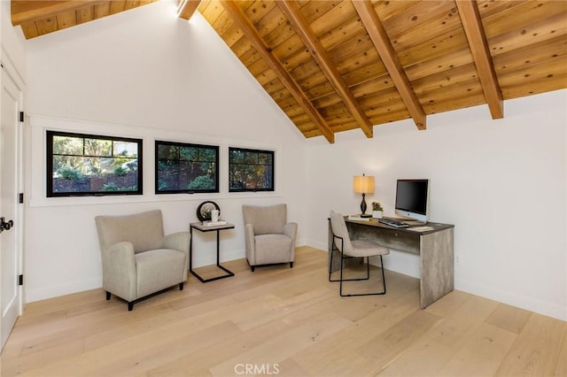 office area with beam ceiling, high vaulted ceiling, light wood-type flooring, wooden ceiling, and baseboards