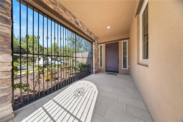 entrance to property with stucco siding