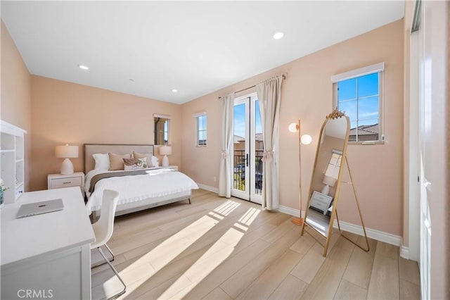 bedroom featuring light wood finished floors, access to outside, baseboards, and recessed lighting