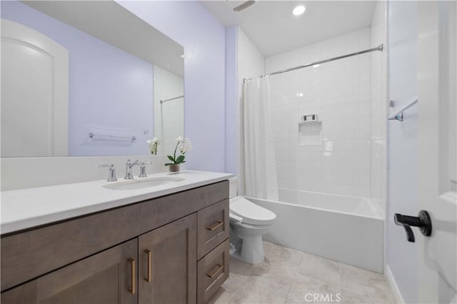 full bathroom with shower / tub combo with curtain, vanity, and toilet