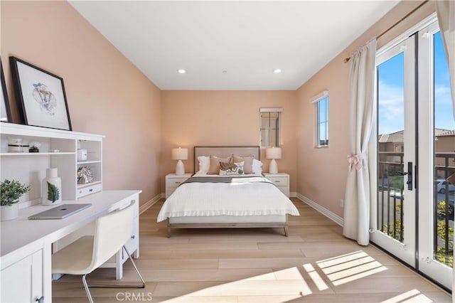 bedroom featuring baseboards, light wood-style flooring, access to outside, built in desk, and recessed lighting