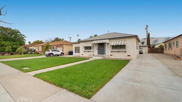 view of front of home featuring a front yard, entry steps, and stucco siding