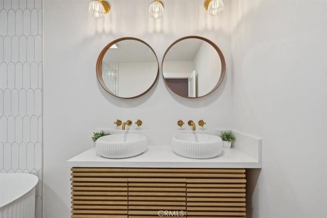 bathroom featuring double vanity and a sink