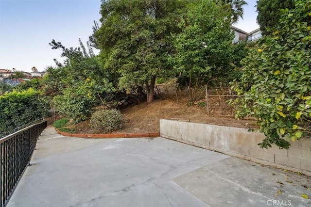 view of patio / terrace featuring fence