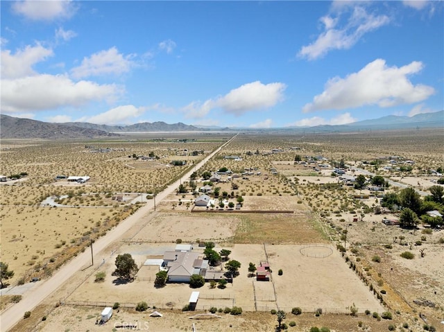 bird's eye view featuring a rural view, a desert view, and a mountain view