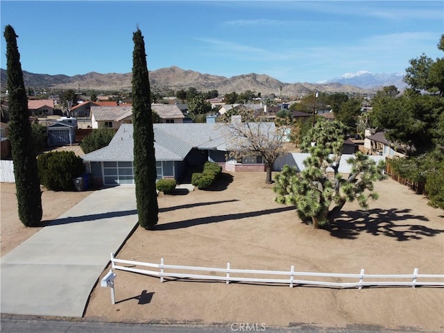 exterior space with a residential view and a mountain view