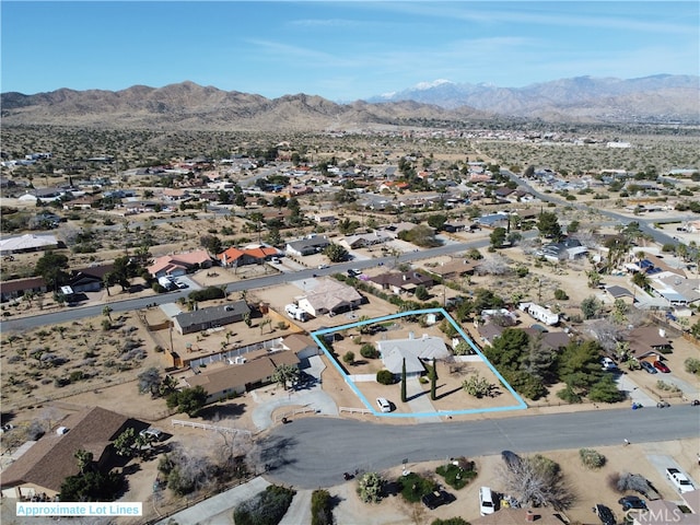 aerial view with a mountain view and view of desert