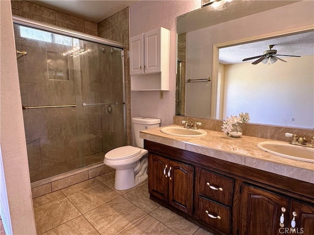 full bath featuring a sink, toilet, and a shower stall