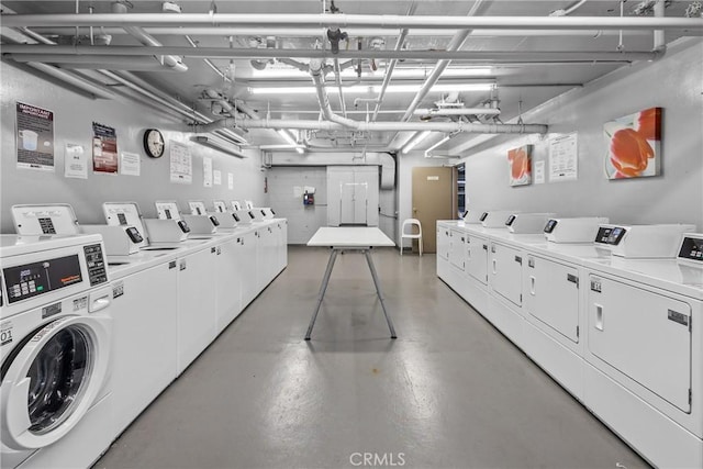 common laundry area featuring a garage and separate washer and dryer