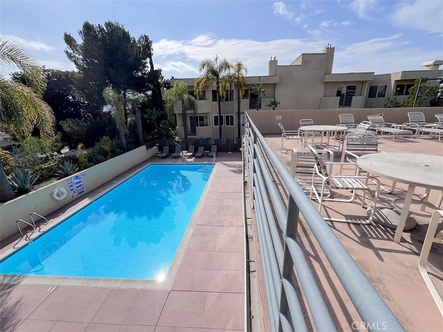 pool with a patio