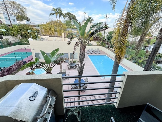 view of pool with fence