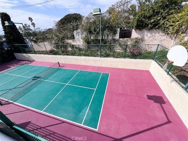 view of tennis court with fence